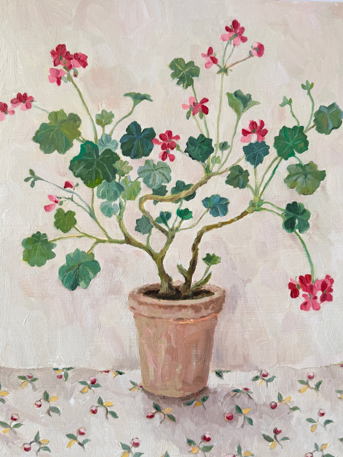 Favourite tablecloth and a red pelargonium