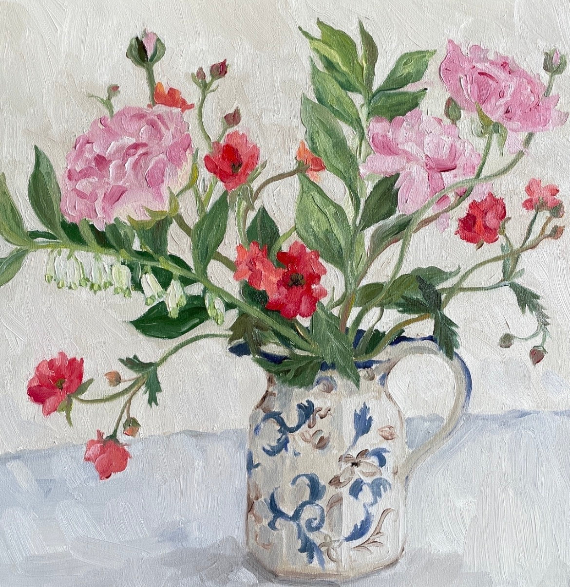 ranunculus and geum in a jug