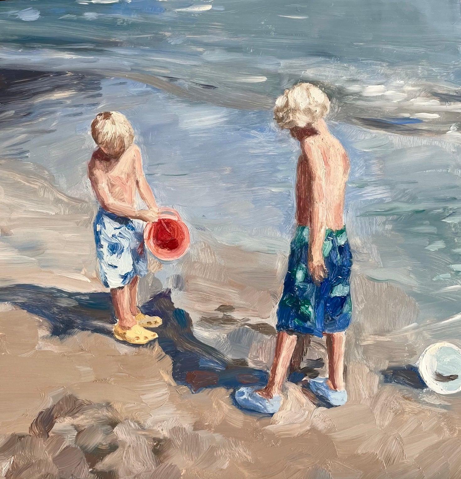 oil painting of two children making sandcastles on a beach